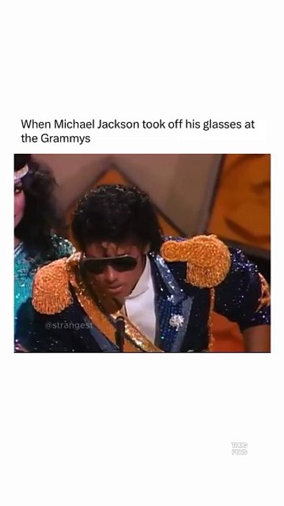 Michael Jackson taking his sun glass