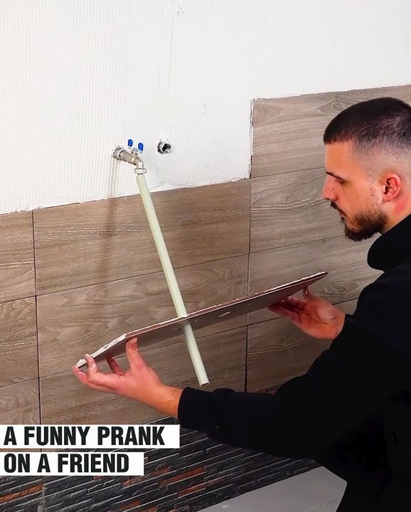 A hilarious video of two friends laying tiles together!