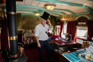 Man living at old railway station turned train carriage into Airbnb