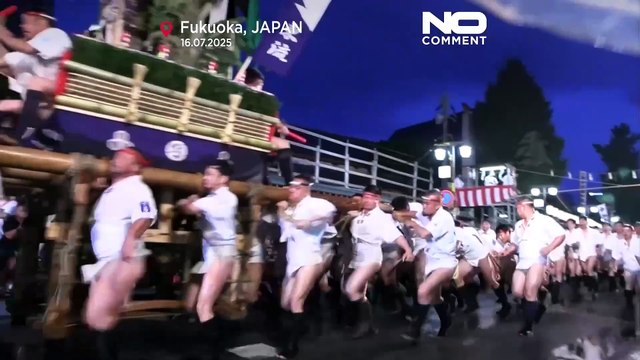 Men race through Fukuoka with one-tonne floats at Hakata Gion Yamakasa Festival