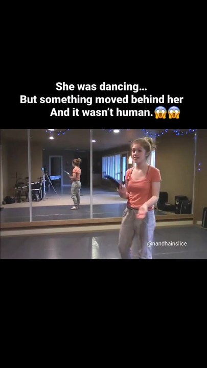 She was just trying to finish her video, like she normally does. Everything seemed fine—until she saw a shadow moving in the mirror. There was no one else around. Her eyes widened in fear, and without wasting