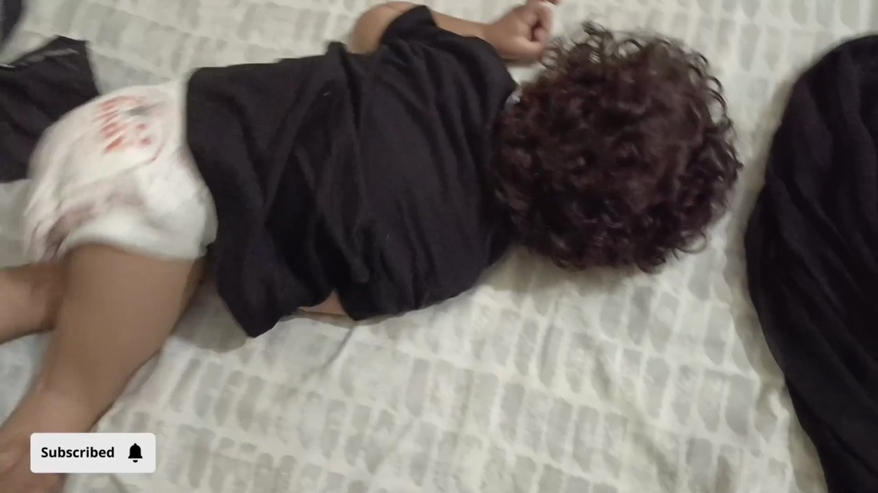 Due to loaded and leaked diaper, baby is out of control and upside down on bed😉
