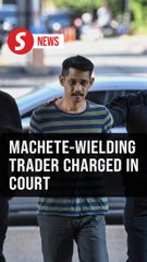 Trader claims trial to intimidating cops with machete