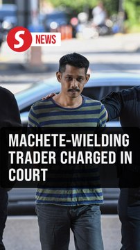 Trader claims trial to intimidating cops with machete