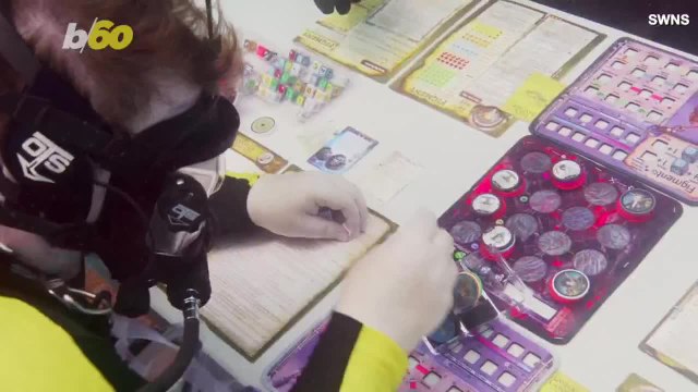 Check Out This Video of Divers Braving Shark Infested Waters to Play Board Games
