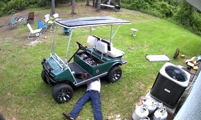 Golf Cart Nearly Runs Over Man While He�s Lying Underneath Making Repairs
