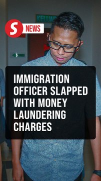 Immigration officer claims trial to money laundering charges involving over RM900,000