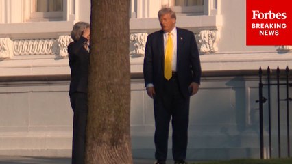 President Trump And Chief Of Staff Susie Wiles Walk Together On The White House North Lawn