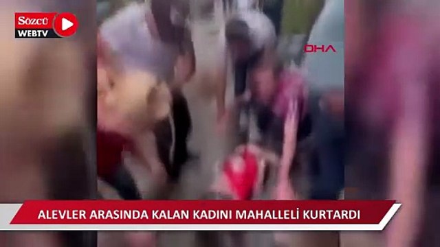 Bursa'da 4 katlı binada çıkan yangında alevler arasında kalan kadını mahalleli kurtardı