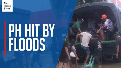 Residents evacuated by truck, makeshift rafts after monsoon rains batter the Philippines