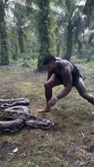 Epic Showdown: Muscular Man Battles Reticulated Python 🐍