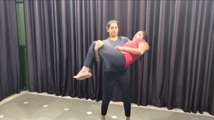 lift and carry | young girl carry a beautiful woman