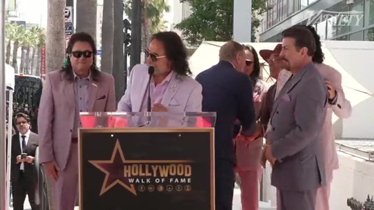 Marco Antonio Solis speaks on behalf of Los Bukis at their Hollywood Walk of Fame ceremony