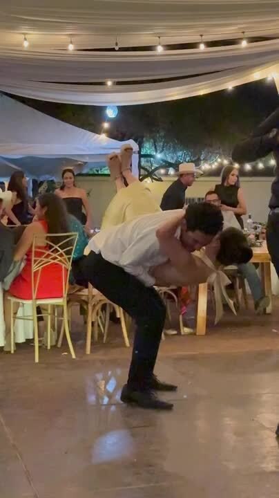 Couple Falls While Dancing During Celebration