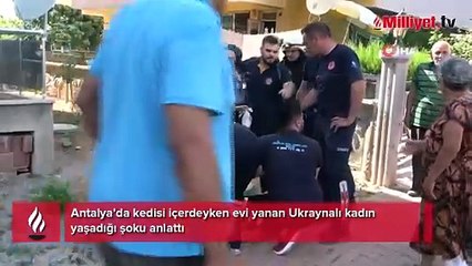 Kedisi içerdeyken evi yanan Ukraynalı kadın polisin kucağına bayıldı