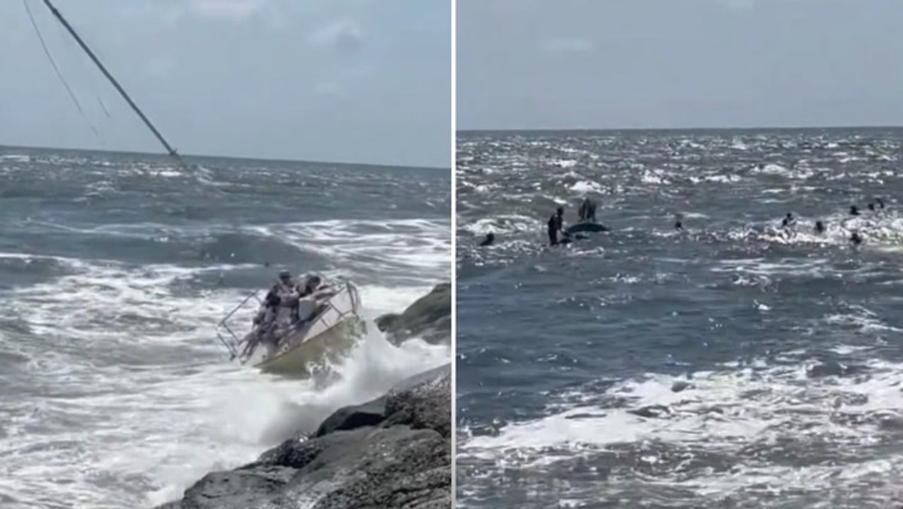 Ten people rescued after sailboat giving lesson to teenagers is smashed onto rocks on the Jersey shore