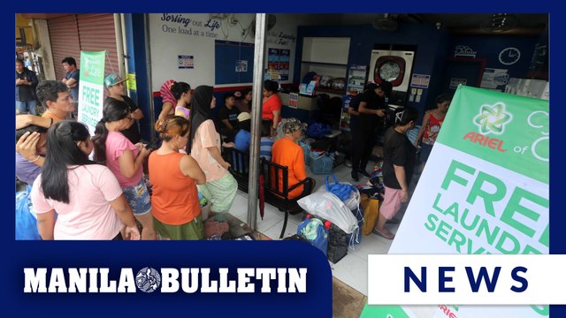 Residents take use of free laundry services after week-long rains in Quezon City