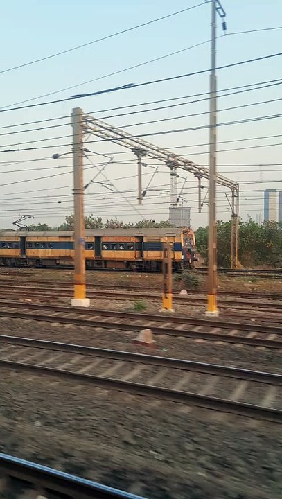 Diva Vasai MEMU crossing by Local 20240226_180533