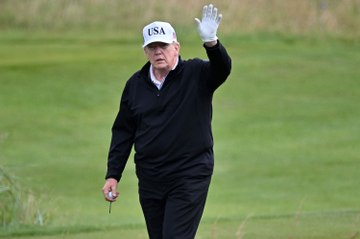 Trump plays golf in Scotland while protesters take to the streets