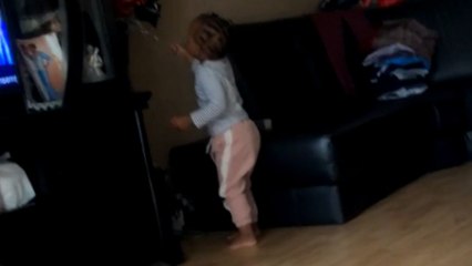 Kid gets caught off guard by falling flower pot while listening to a song
