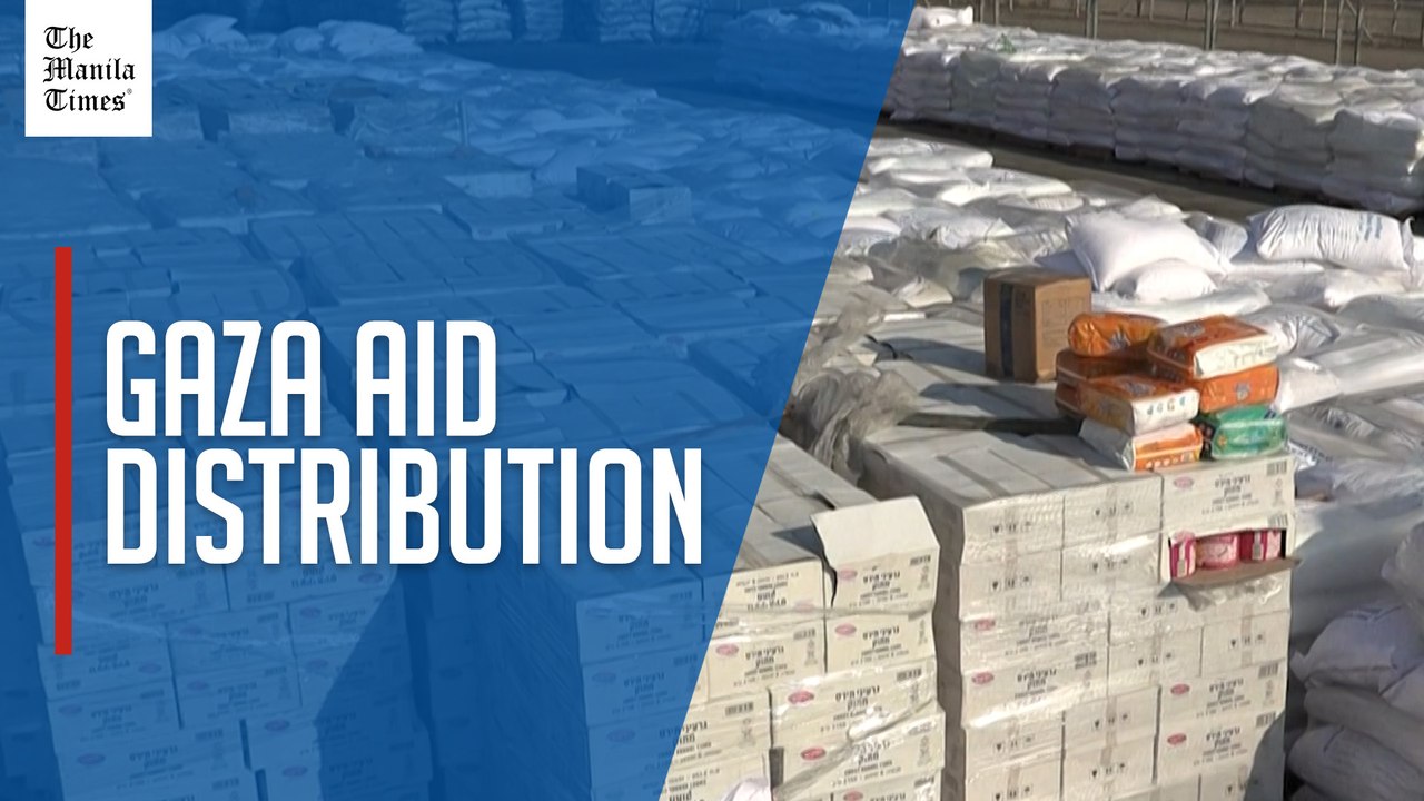 Trucks carrying aid are unloaded, parcels await distribution at Gaza border crossing