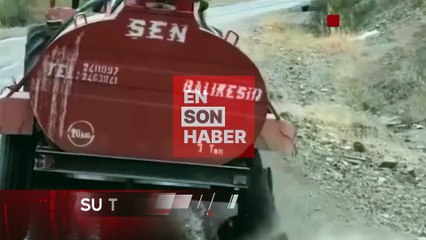 Bursa'da traktörünün lastiği patlamasına rağmen yangın bölgesine su taşımaktan vazgeçmeyen vatandaş