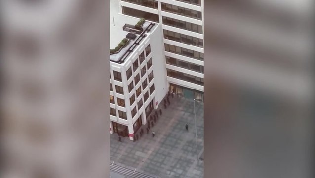 Police descend on New York City skyscraper after police officer and three others killed in Manhattan shooting