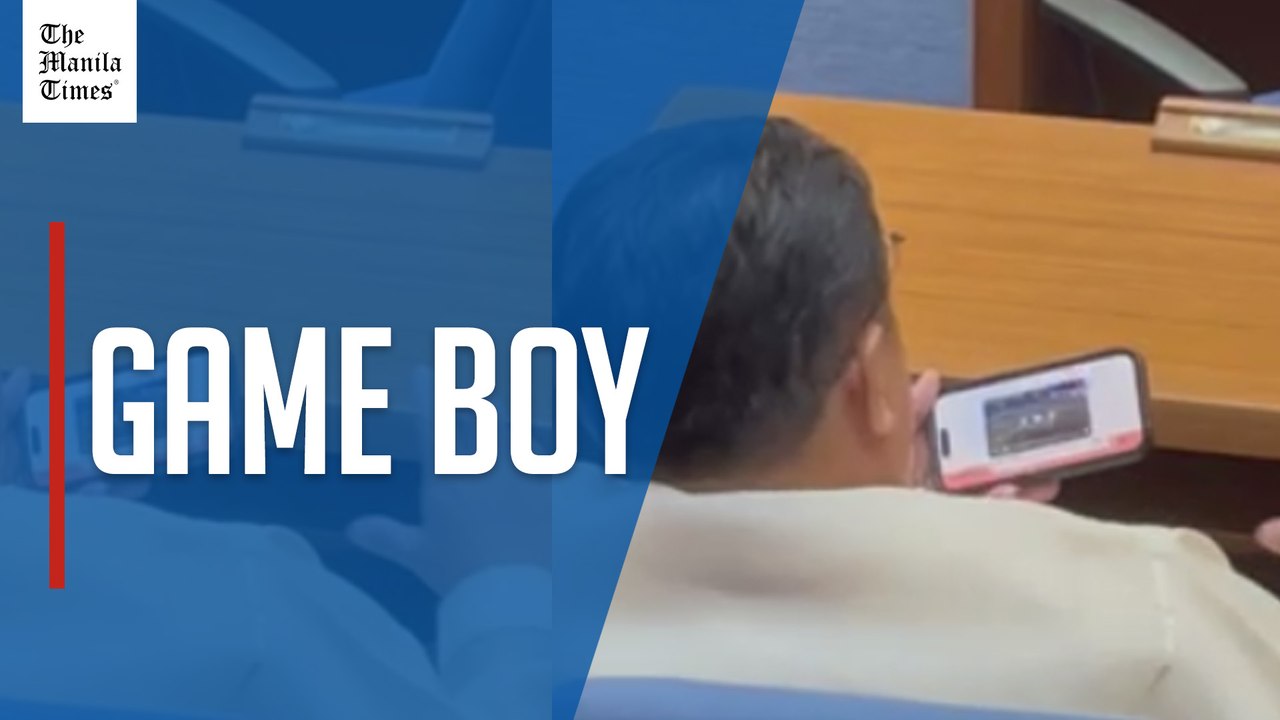 Lawmaker pulls out mobile phone to check out video of another fight outside House