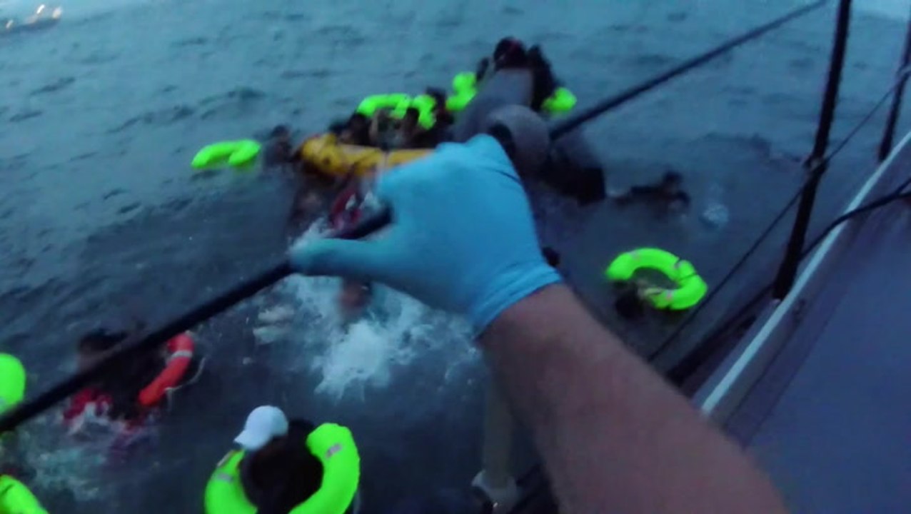 Dramatic footage shows RNLI lifeboat crew rescue 19 migrants from stricken dinghy in English Channel