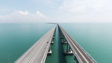 aerial view of a long bridge over water