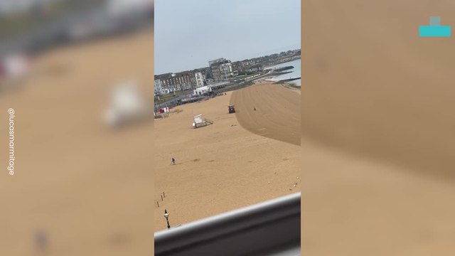 Tractor Drives Around Sleeping Person on Beach