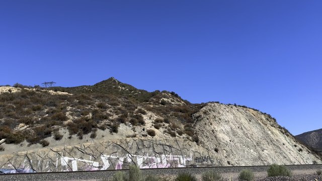 UP 5527 Leads Southbound Manifest Train Rolling Through Blue Cut CA.