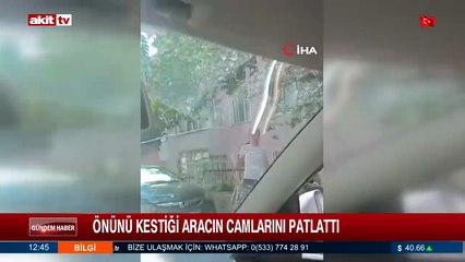 Önünü kestiği aracın camlarını patlattı