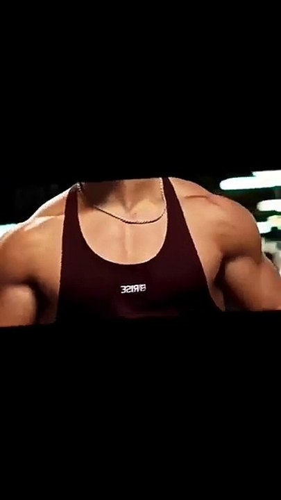 A Confident Young Man Shows Off His Physique