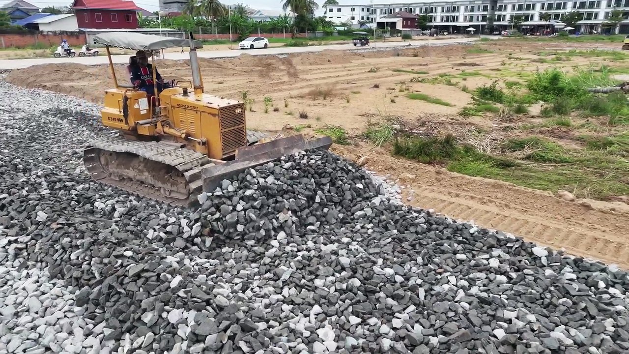 Amazing technology in the road construction process, gravel paving machinery in paving new roads.