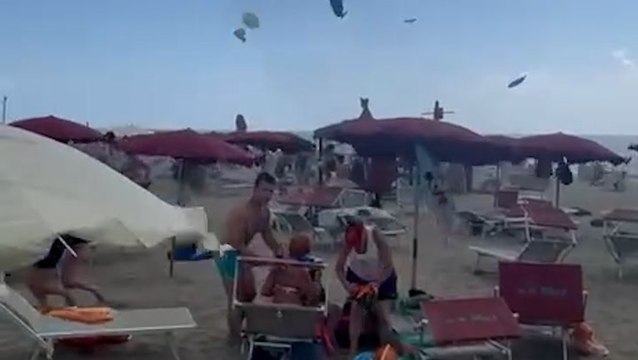 Tourists flee as tornado hits Italian beach, sending parasols flying