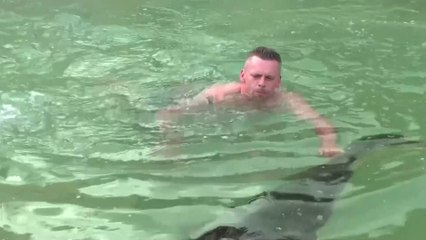 German Man Hugs His 2-Meter Pet Caiman