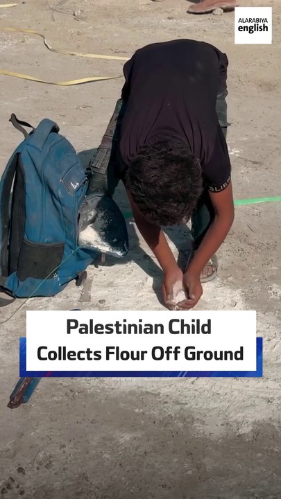 Palestinian Child Collects Flour Off Ground