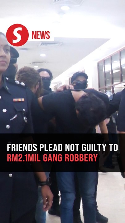 Two men claim trial to robbing Chinese national of RM2.1mil
