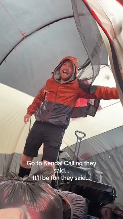 Man Struggles to Hold Onto Tent Amid Storm Floris in UK