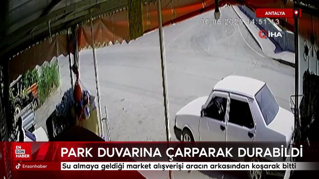 Antalya'da el freni çekmeyi unutup arkasından koştuğu otomobil park duvarına çarparak durabildi