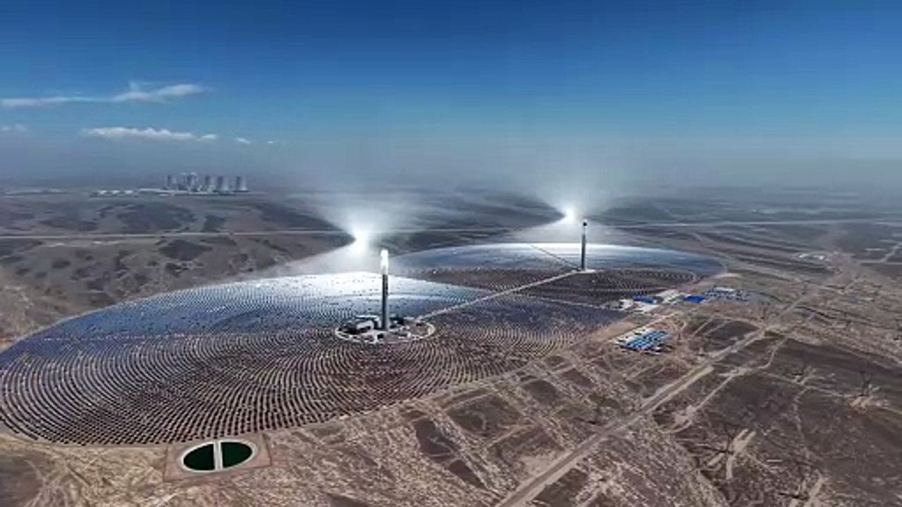 China_s twin solar thermal towers. Molten salt stores the heat to produce electricity