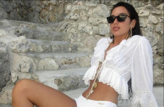 Dua Lipa shows off seductive figure in revealing white two-piece