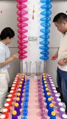 This looks like such a fun party game! First, they race to pop the balloons, then it's a speed and memory test with the cups to see who can fill their vase first. So much chaotic energy!