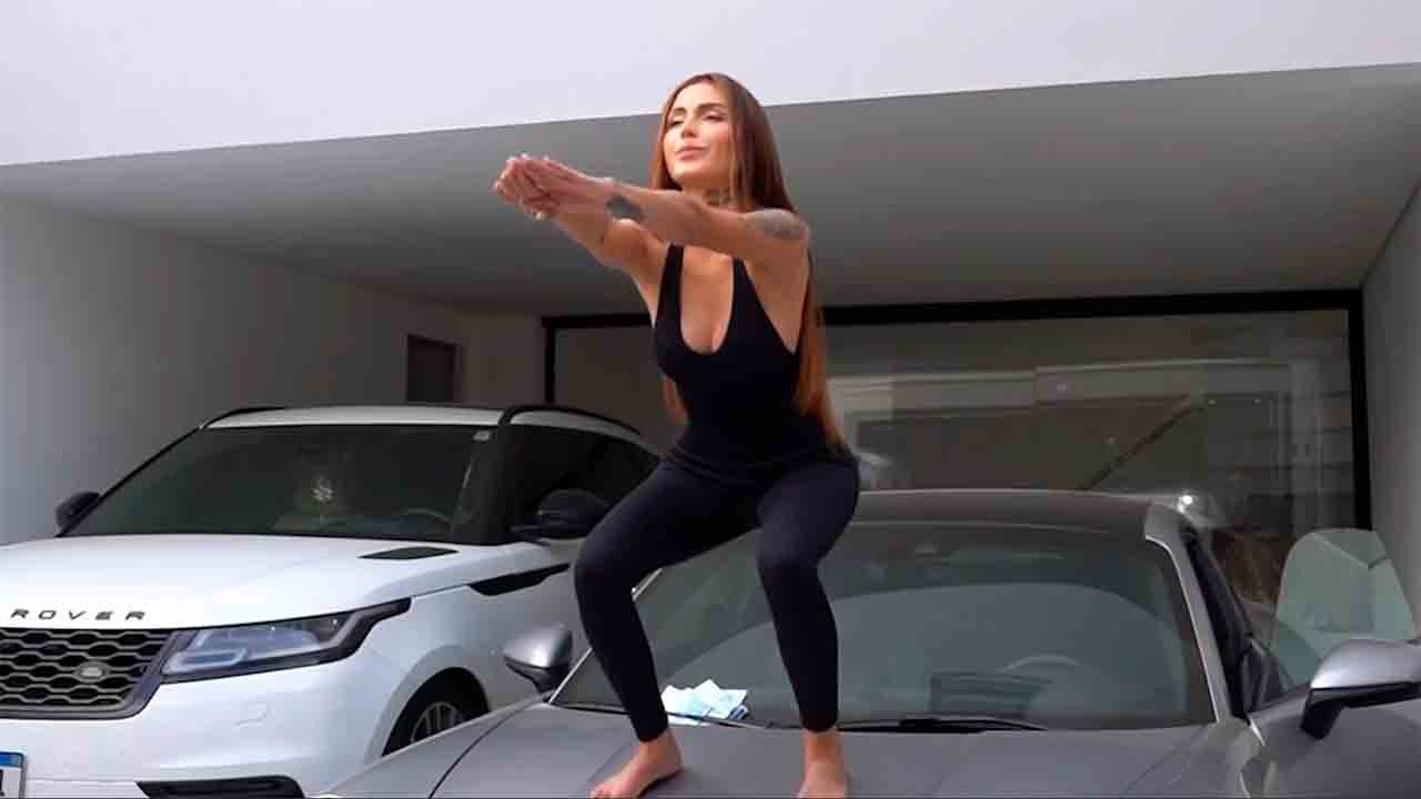 Video: Brazilian Influencer Leaves Internet Stunned by Working Out on Top of a Porsche 911