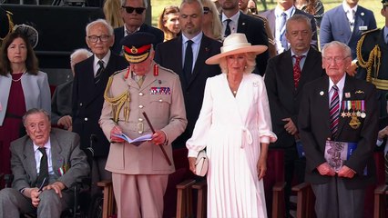 King and Queen observe flypast at VJ Day memorial event