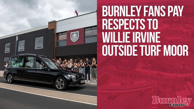 Burnley fans pay respects to Willie Irvine on Harry Potts Way outside Turf Moor