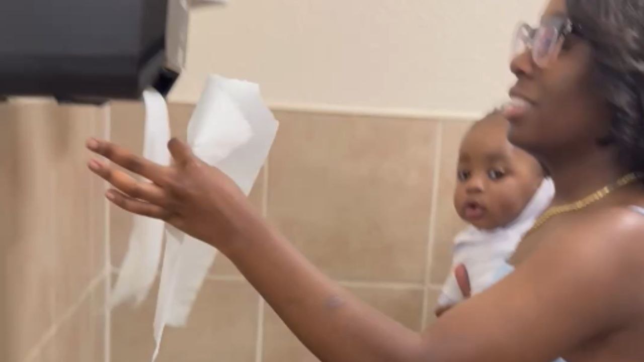 Baby finds endless joy in watching napkins come out of motion-activated dispenser