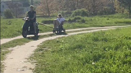 Youngsters create the most unusual ride with a baby stroller and a scooty