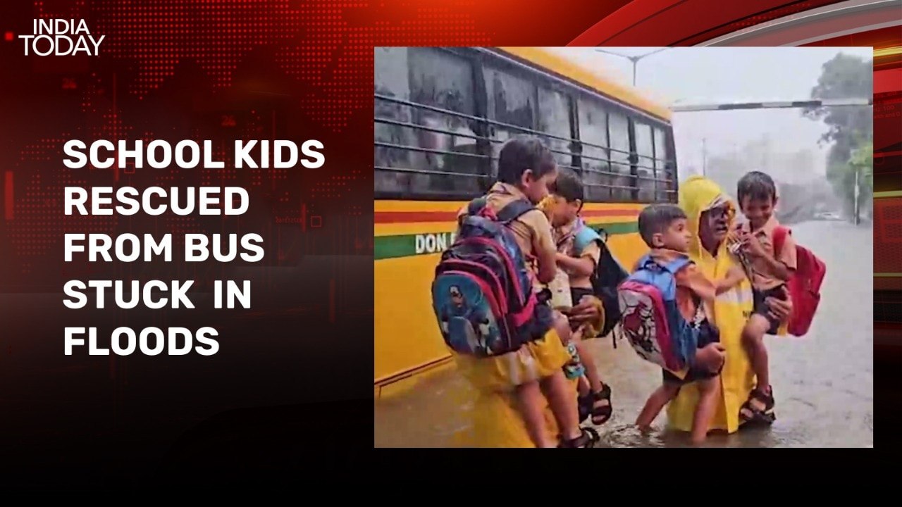 Video: Police rescue kids from school bus stuck in waterlogged road in Mumbai